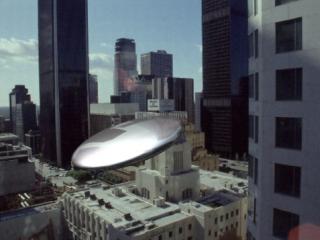 Ufo flying around shadow catcher geometry
                      'hiding' in front of still image of cityscape5